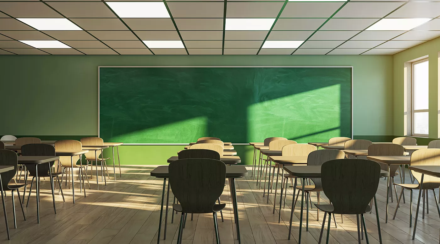 Empy classroom with a green blackboard